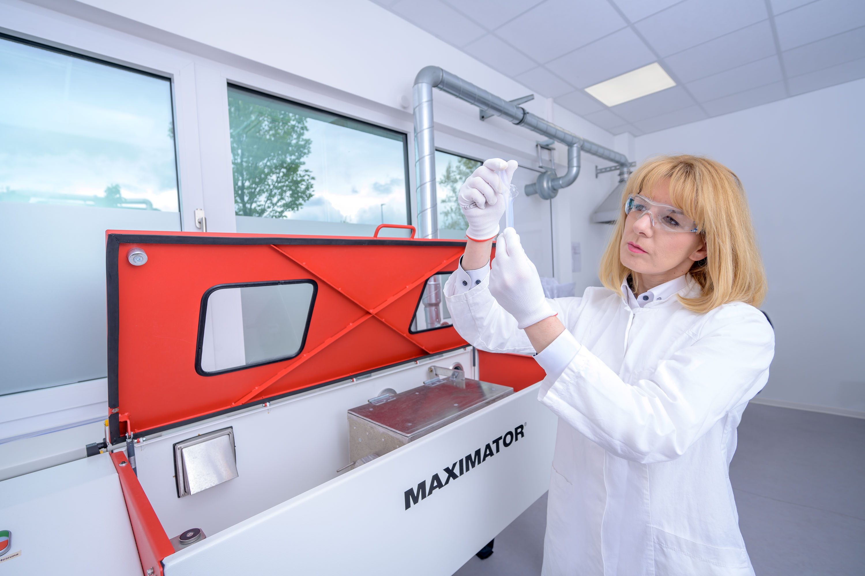 Photo of an APT quality inspection employee - test for tube bursting strength