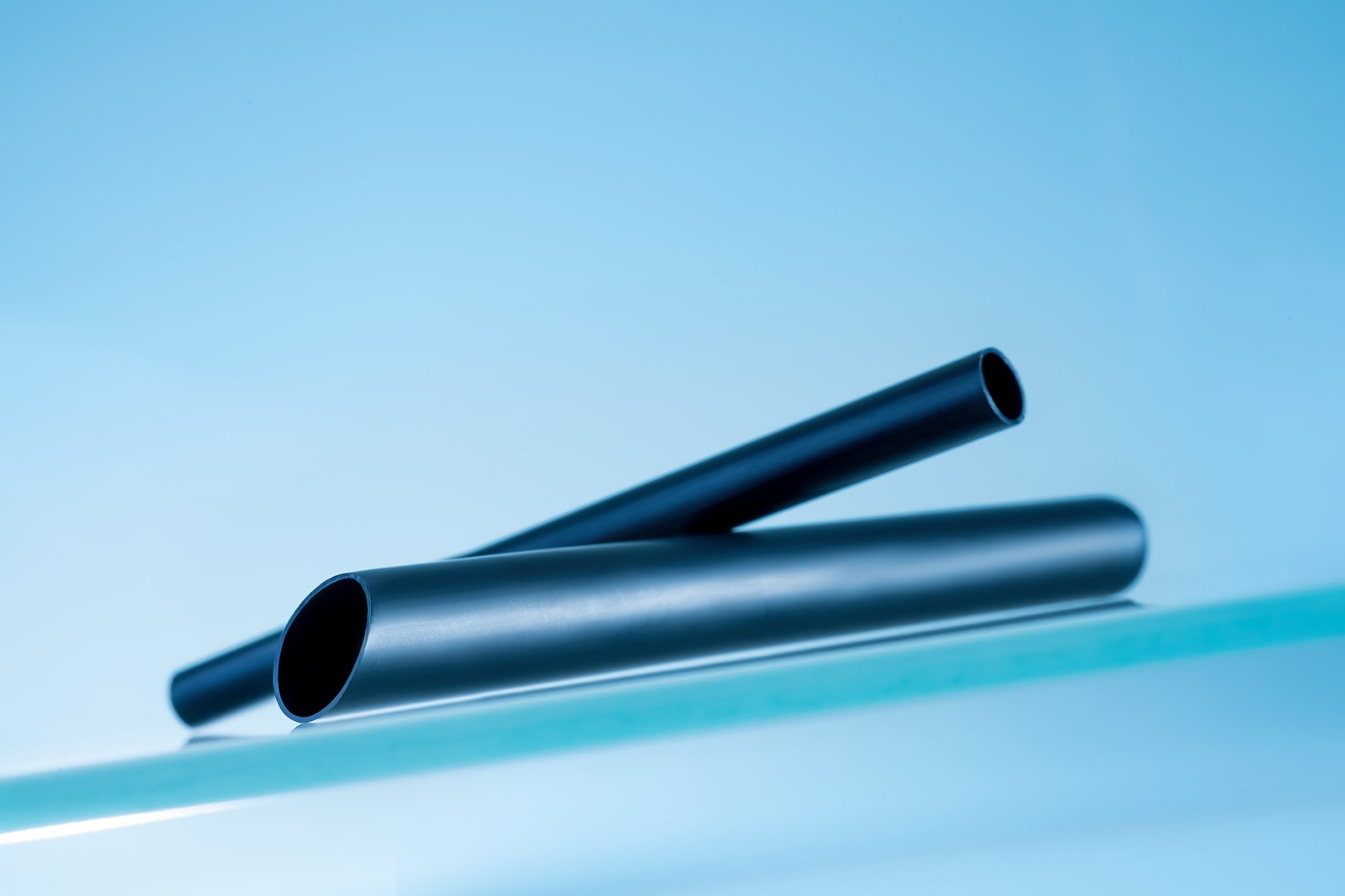 Product image: Black high-purity PFA plastic tubing with electrically conductive strips for sensitive applications in semiconductor applications