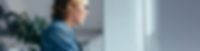 Masterflex Group Teaser job advertisement Woman sitting in front of PC with coffee cup.
