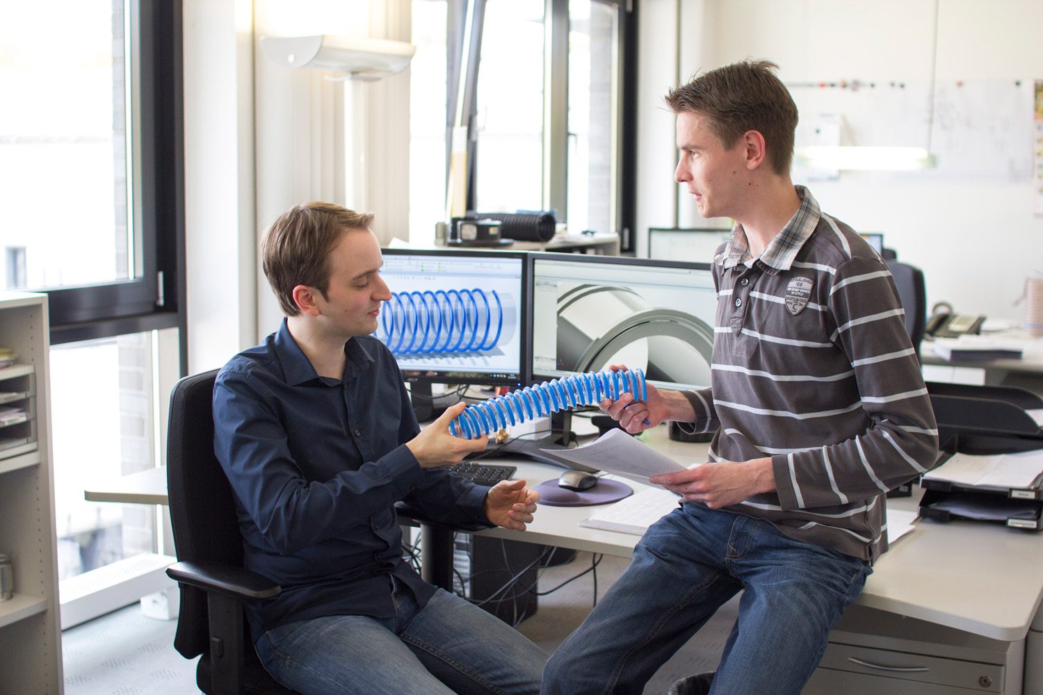 Photo of two employees of the development department