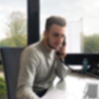 Training as industrial clerk at Masterflexgroup2 Man sitting at desk and talking on phone