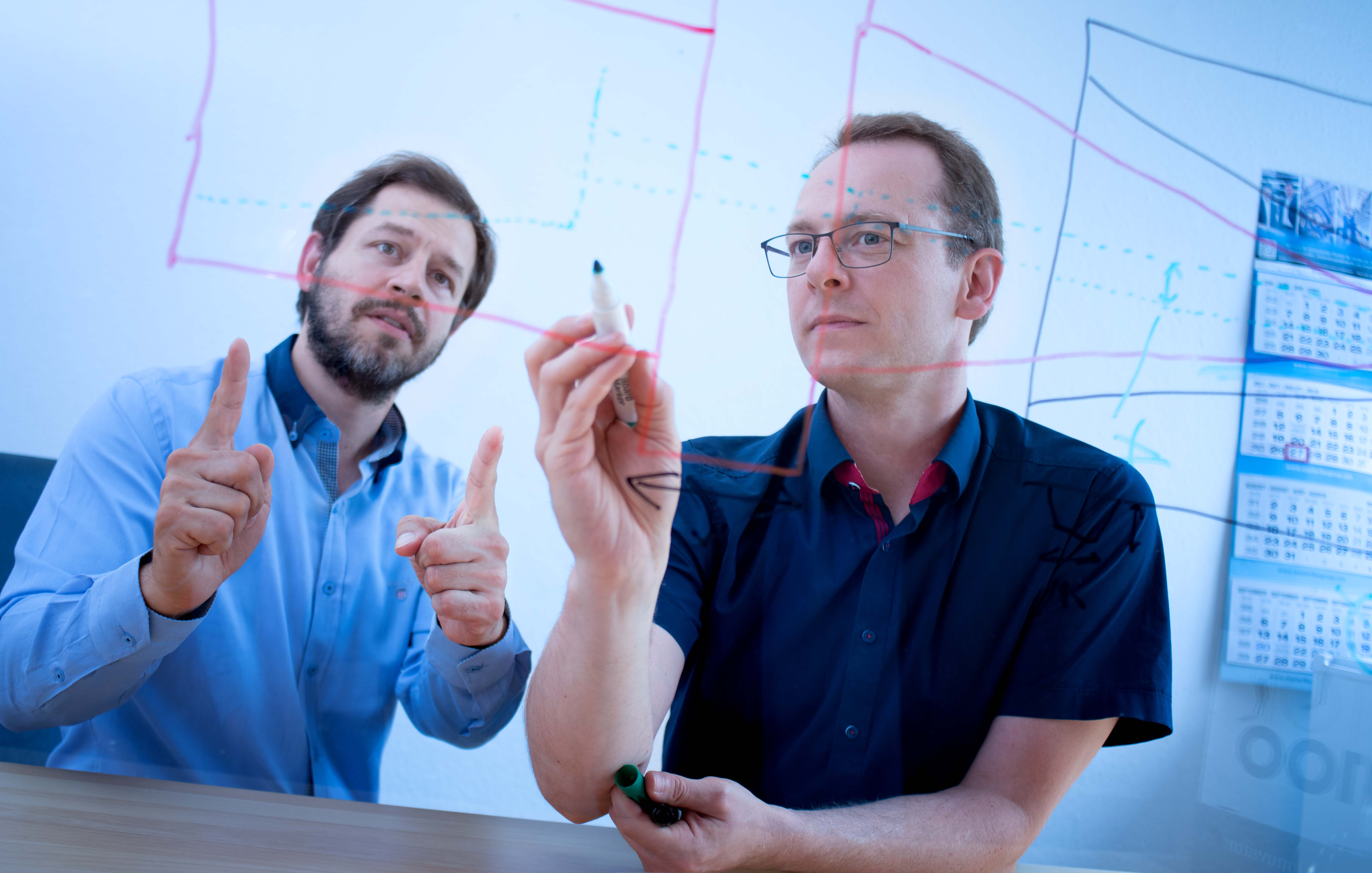 Fleima: two people sitting at desk