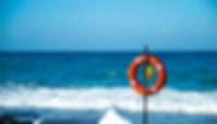 Masterflex Group vacation mood picture Masterflex Group vacation mood picture: Lifebelt in front of blue sea