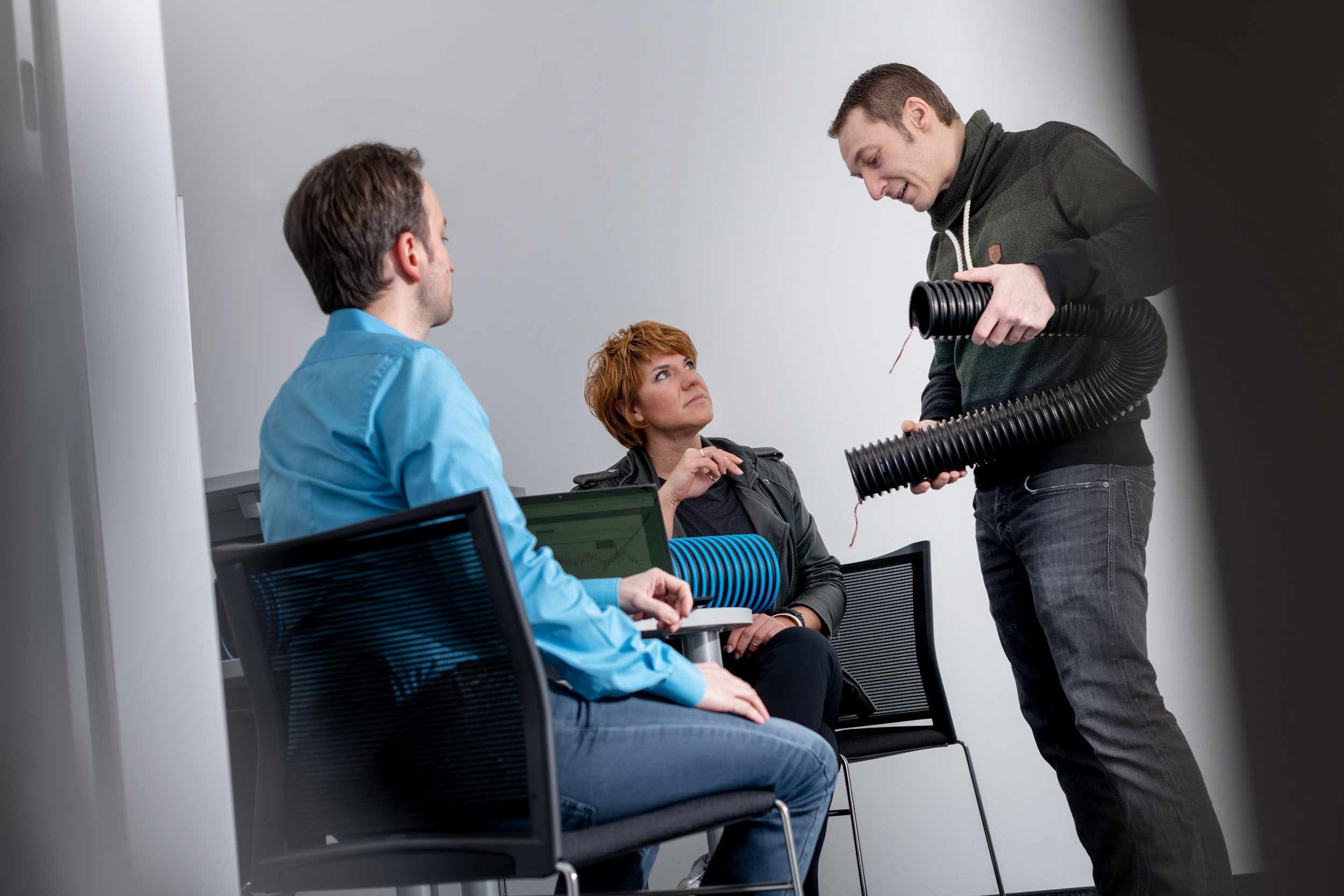 Masterflex Group: Employees talking about product in the office