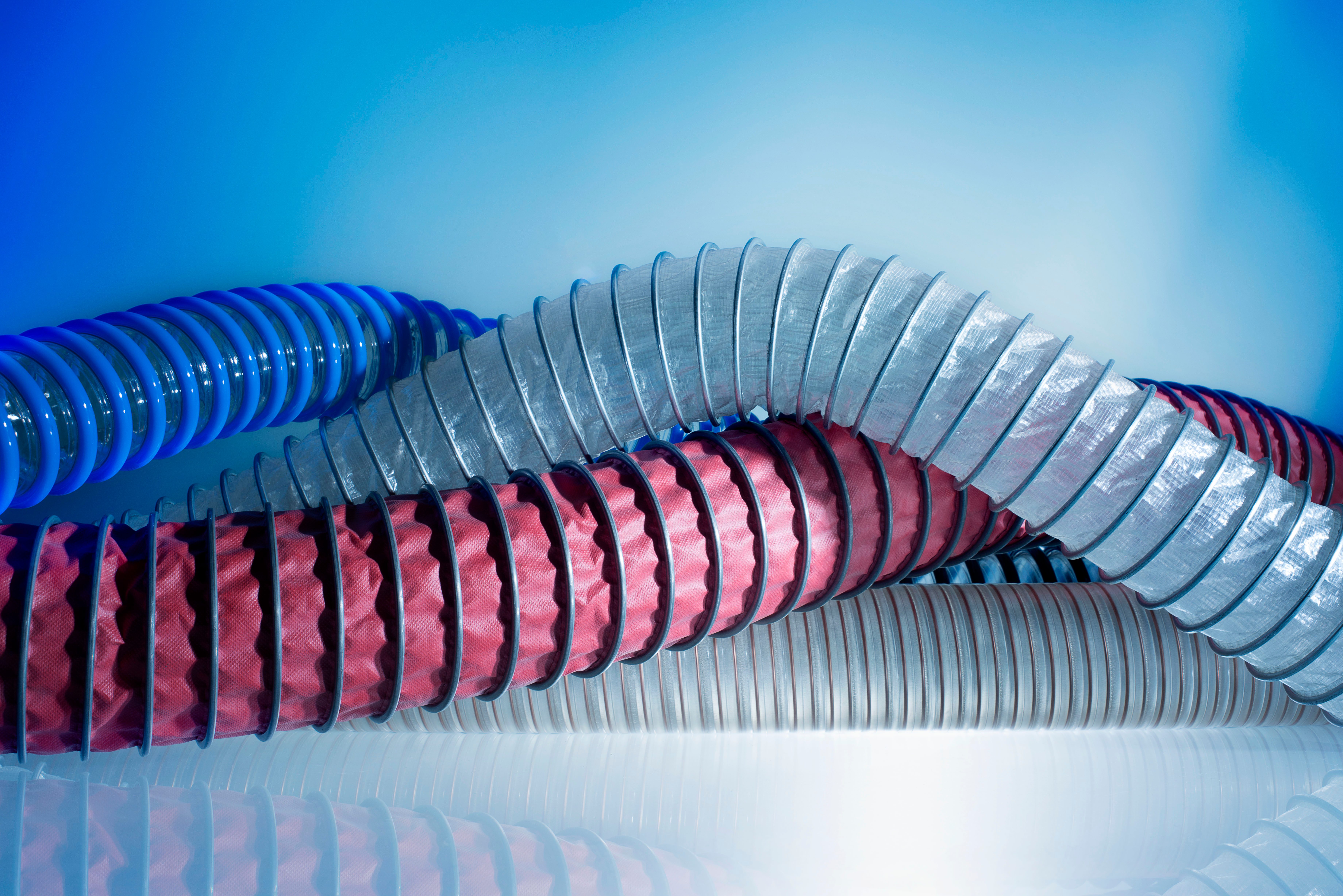 Four different hoses in different colours e.g. black/blue or red/black to show the diversity.