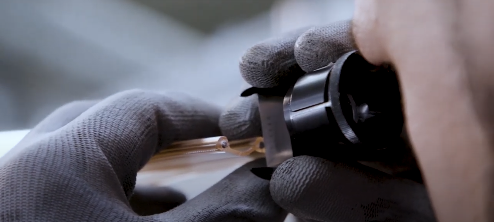 The wall thickness of an extruded tube is measured with the measuring magnifier.