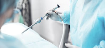 Mood image: Surgeon with a surgical instrument in his hand